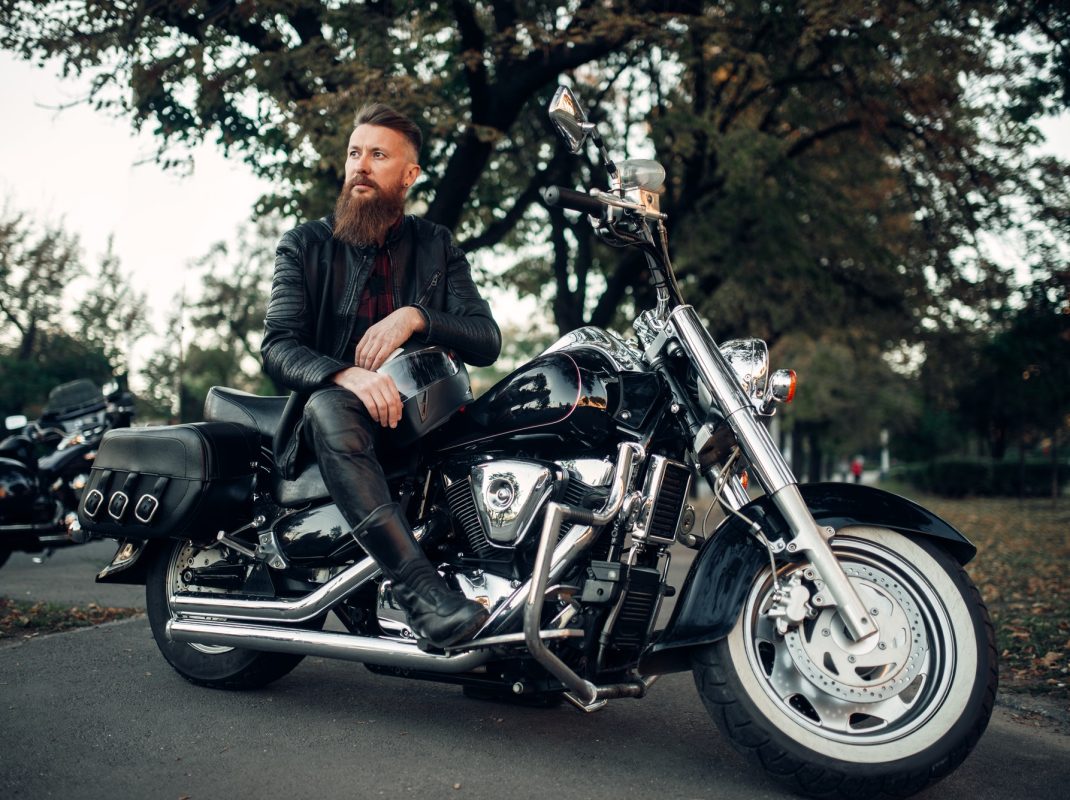 baerded-biker-poses-on-chopper-leaning-on-a-helmet.jpg baerded-biker-poses-on-chopper-leaning-on-a-helmet.jpg